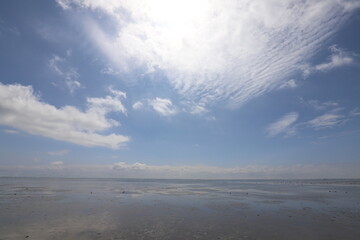 Beautiful panoramic view over the Sea at very low tide with a blue sky.  Photo was taken on a sunny May day with a beautiful blue lunch with white clouds.