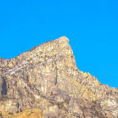 Square frame Steep peak and rocky slopes of a mountain in Provo Canyon Utah on a sunny day