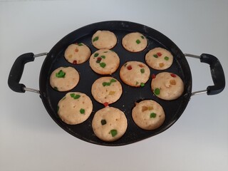 Pan cakes in pan on white background