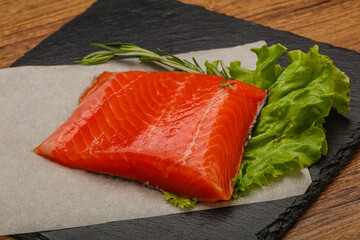 Salmon piece steak served rosemary