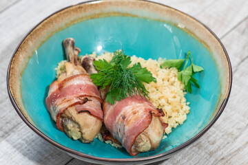 Delicious millet porridge with chicken legs and bacon