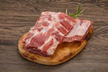 Raw pork ribs served rosemary