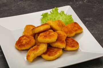Fried chicken nuggets served salad leaves