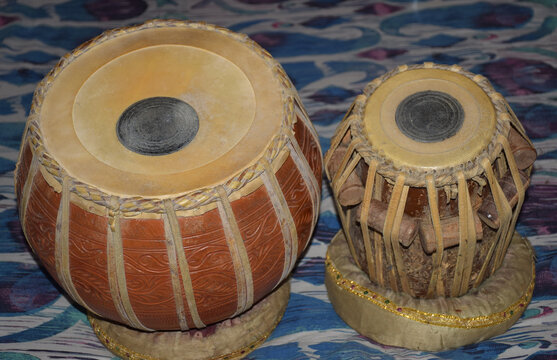 Tabla Musical instrument.It consists of two single-headed, barrel-shaped drums.The left part is called as baya and right part as Daya in Hindi Language. The bigger drum(left) is made of clay or mud.
