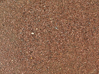 Beige stone gravel background texture. Brown small rocks abstract road pavement pattern