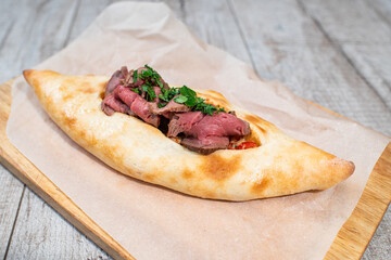 Tasty Georgian khachapuri with meat