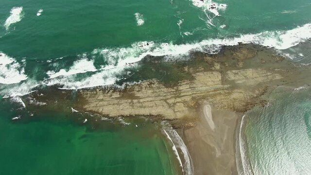 Beautiful cinematic aerial footage of the Whale Tale beach in the Marino Ballena National Park in Costa Rica
