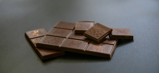broken chocolate bar on a dark background