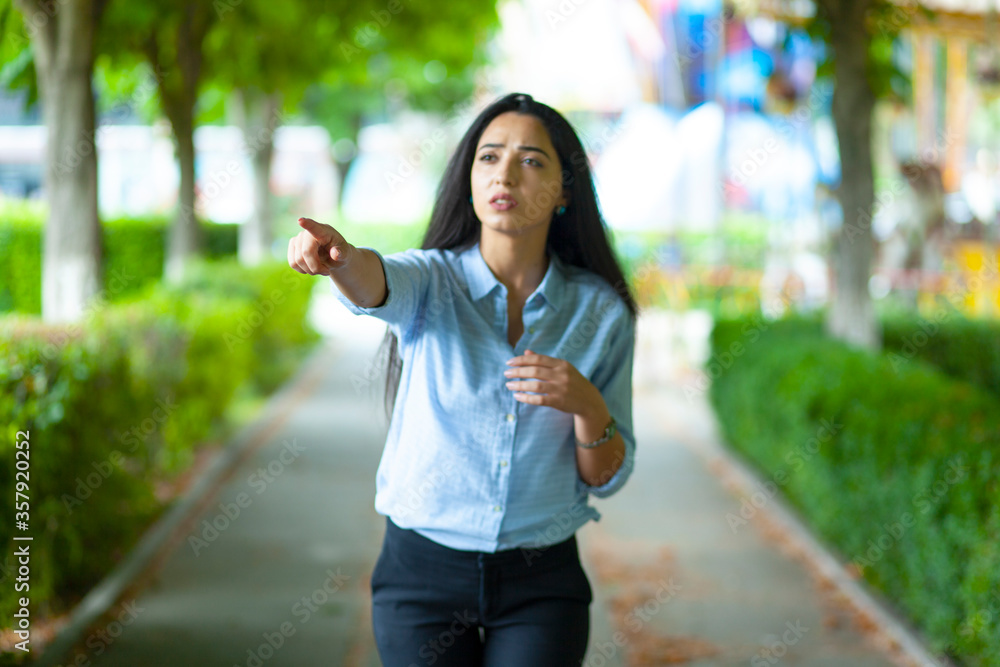 Wall mural woman finger show in street