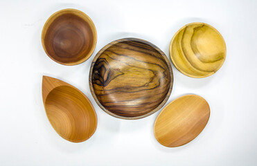 Set of cutlery and kitchen utensils made of wood. Isolated.