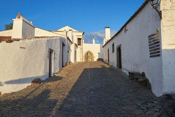 Fototapeta na wymiar Street with white houses in Monsaraz, a village inside castle walls, Alentejo, Portugal 