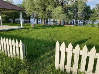 white fence on the green grass