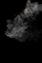 A stream of white smoke on a black background mixes randomly creating bizarre swirl patterns