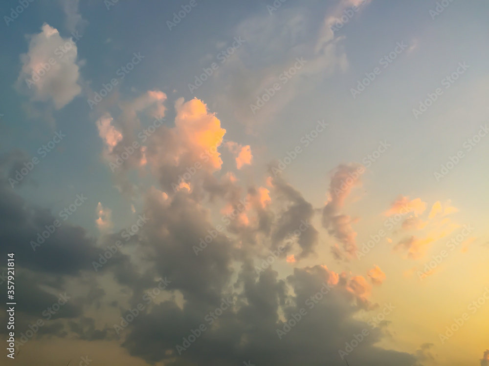 Wall mural sunset with soft blue sky late afternoon background. early morning blue sky and bright clouds with g