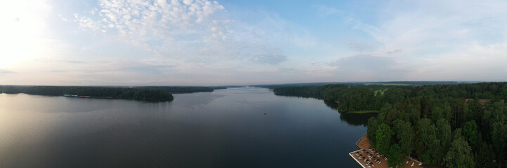 panoramic view of the river with floating boats and beautiful clouds shot from a drone