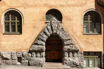 Fototapeta na wymiar Historical building facade and granite entrance in Helsinki, Finland