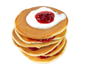 Stack of pancakes with sour cream and raspberry jam on white background