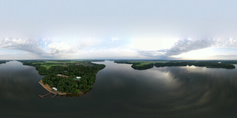 panoramic view of the river with floating boats and beautiful clouds shot from a drone