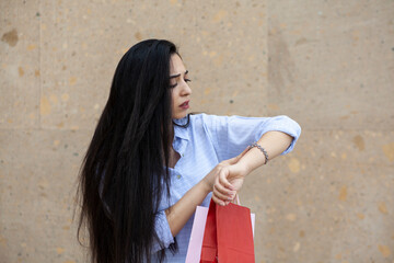 woman hand shopping bags and watch