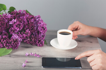  woman hand phone with coffee
