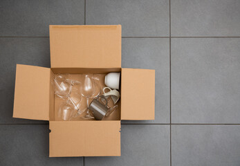 Broken plates or broken glass put in box in the kitchen. The concept of an accident in the kitchen...