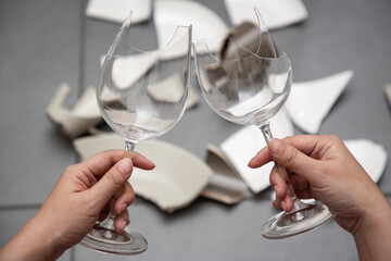 Broken Plate or broken water glass and dishes on the floor in the kitchen room The concept of...