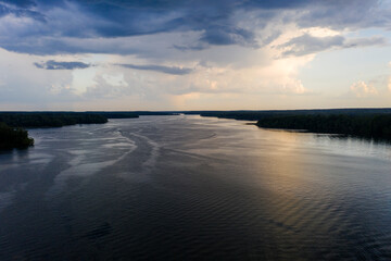 panoramic view of the river with floating boats and beautiful clouds shot from a drone