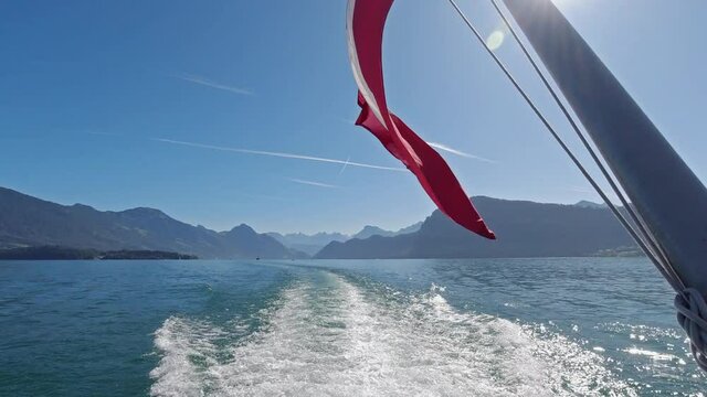 Cruising on ship on Lake Lucerne with beautiful views on Swiss Alps in background