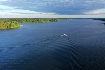 panoramic view of the river with floating boats and beautiful clouds shot from a drone