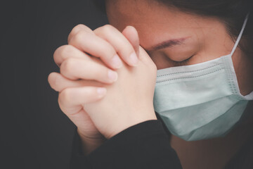 woman praying and worship to GOD Using hands to pray in religious beliefs and worship christian in the church or in general locations in vintage color tone or copy space.