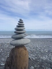 a pile of stones at the Okarito Beach on the South Island in New Zealand, March