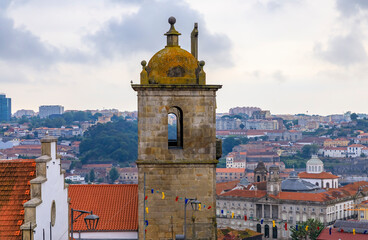 View of Porto Cathedral or Se Catedral and terracotta roofs of the Ribeira and Vila Nova de Gaia in Porto, Portugal