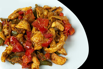 Guiso de pollo con pimientos.