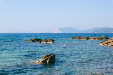 Small rocks over calm sea 