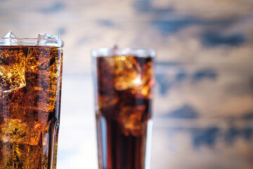 Cold fizzy lemonade on wooden background