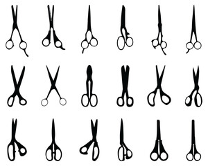 Black silhouettes of different scissors  on a white background