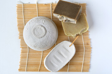 Modeling air dry clay bowl and soap dish on a bamboo mat top view