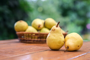 Yellow pears on the wooden table from the top
