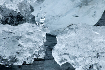 small pieces of ice at volcano black beach iceland
