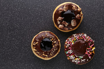  donut decorated with colorful sprinkles isolated on white background. Flat lay. Top view