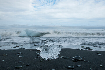 small pieces of ice at volcano black beach iceland