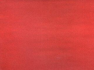 Red background. Velvet fleecy paper texture. Closeup