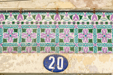 old wall covered with geometric azulejos style in Aveiro, Portugal