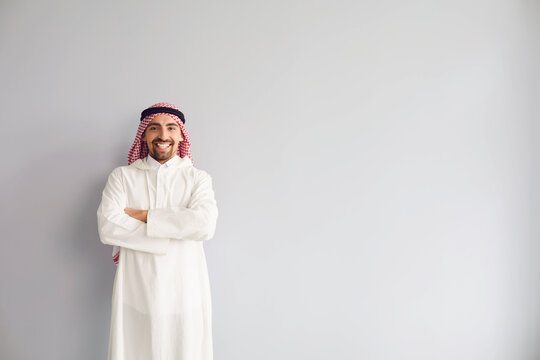 Arab Male Businessman Smiling Portrait Standing On A Gray Background