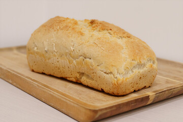 Homemade white bread on wooden board