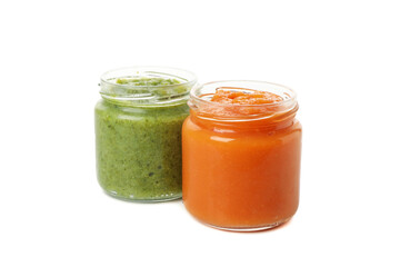 Glass jars with healthy baby food isolated on white background