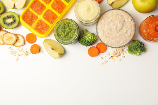 Composition with baby food on white background, top view