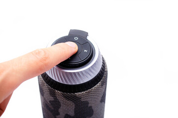 Wireless bluetooth color camouflage military column on a white background. The column stands...