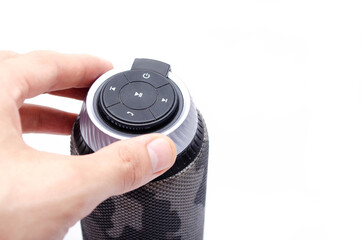 Wireless bluetooth color camouflage military column on a white background. The column stands...