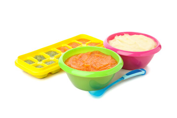 Bowls with vegetable puree on white background. Baby food